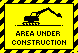 An yellow and black excavator from the 1990 age